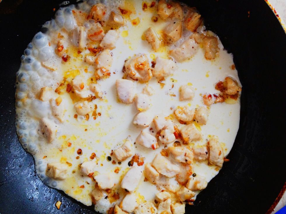 When chicken is cooked add cream, salt and peppers.