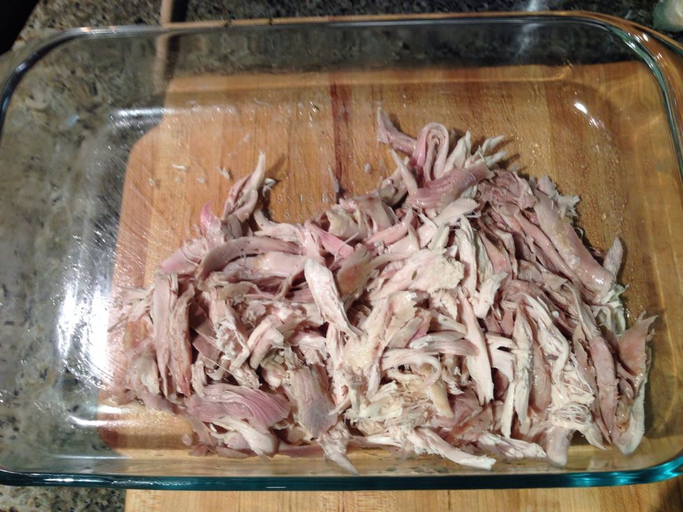 When chicken is cool enough to handle, discard the bones, skin and shred the chicken to your liking.