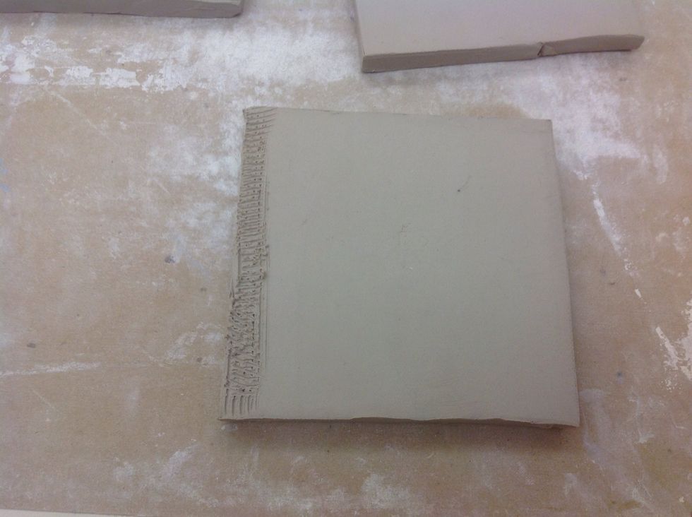 When clay is leatherhard, take an "A" side and slip and score on side.