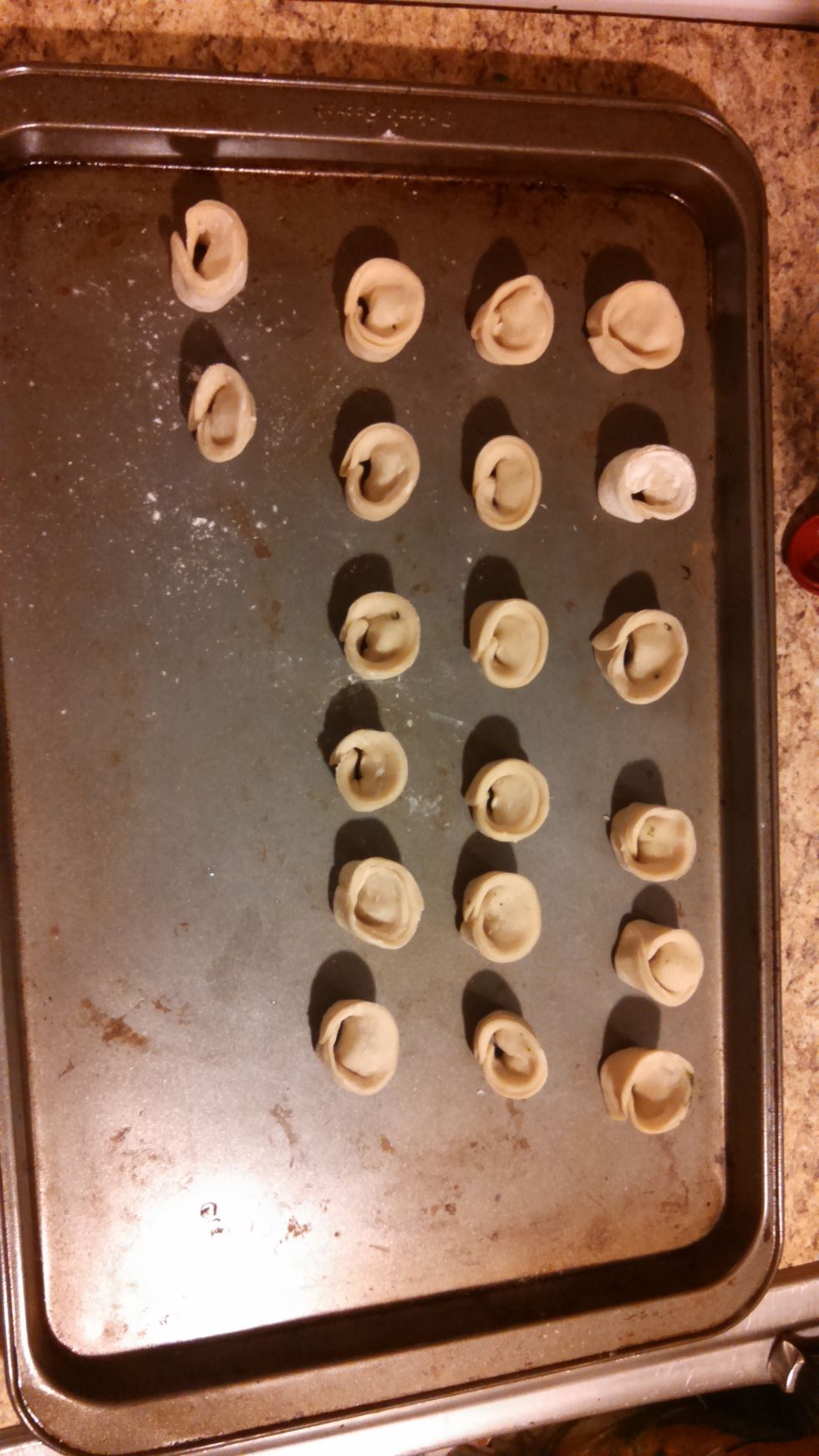 when complete with forming your tortellini place them on a cookie sheet and let stand for about 45 mins. to 1 hr.