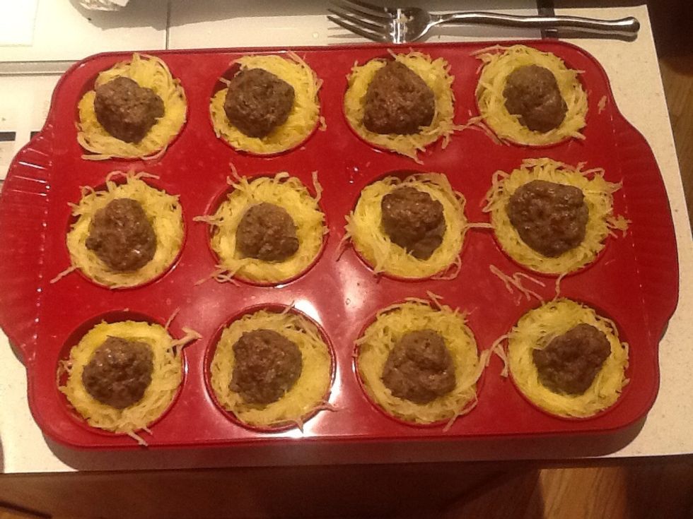 When cooked, center a cooked meatball in each cup of spaghetti squash.