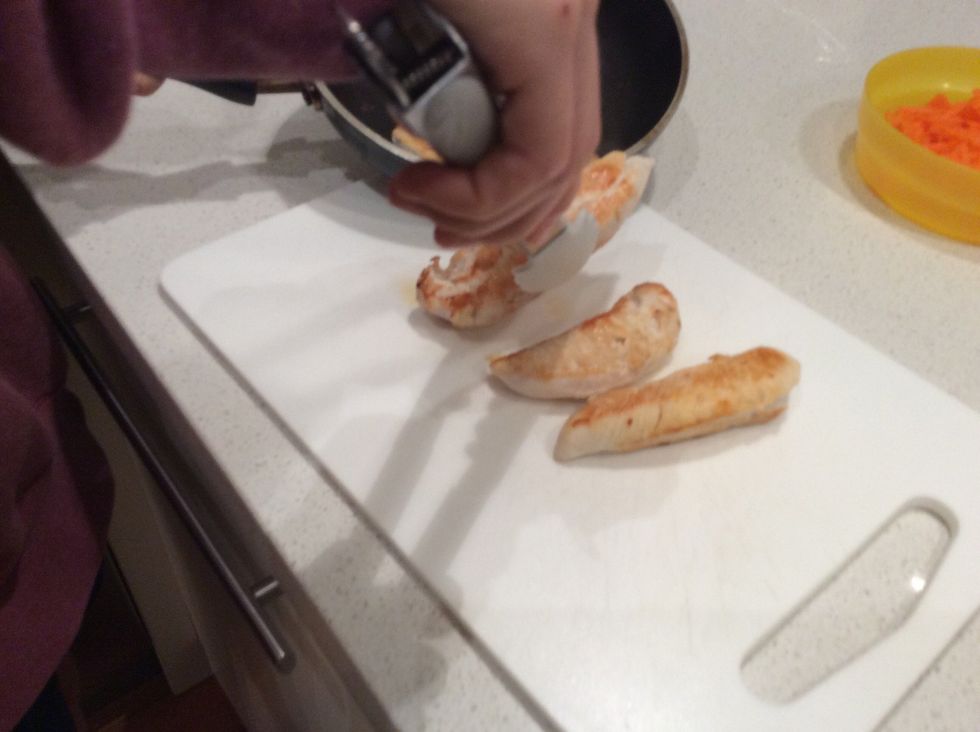 When cooked place the chicken on a chopping board