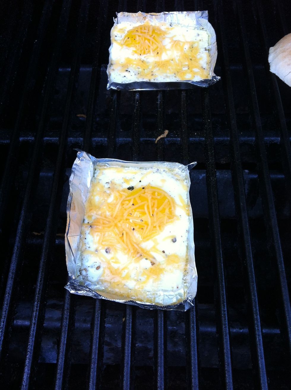 When cooked to just before desired doneness, sprinkle cheese over egg.