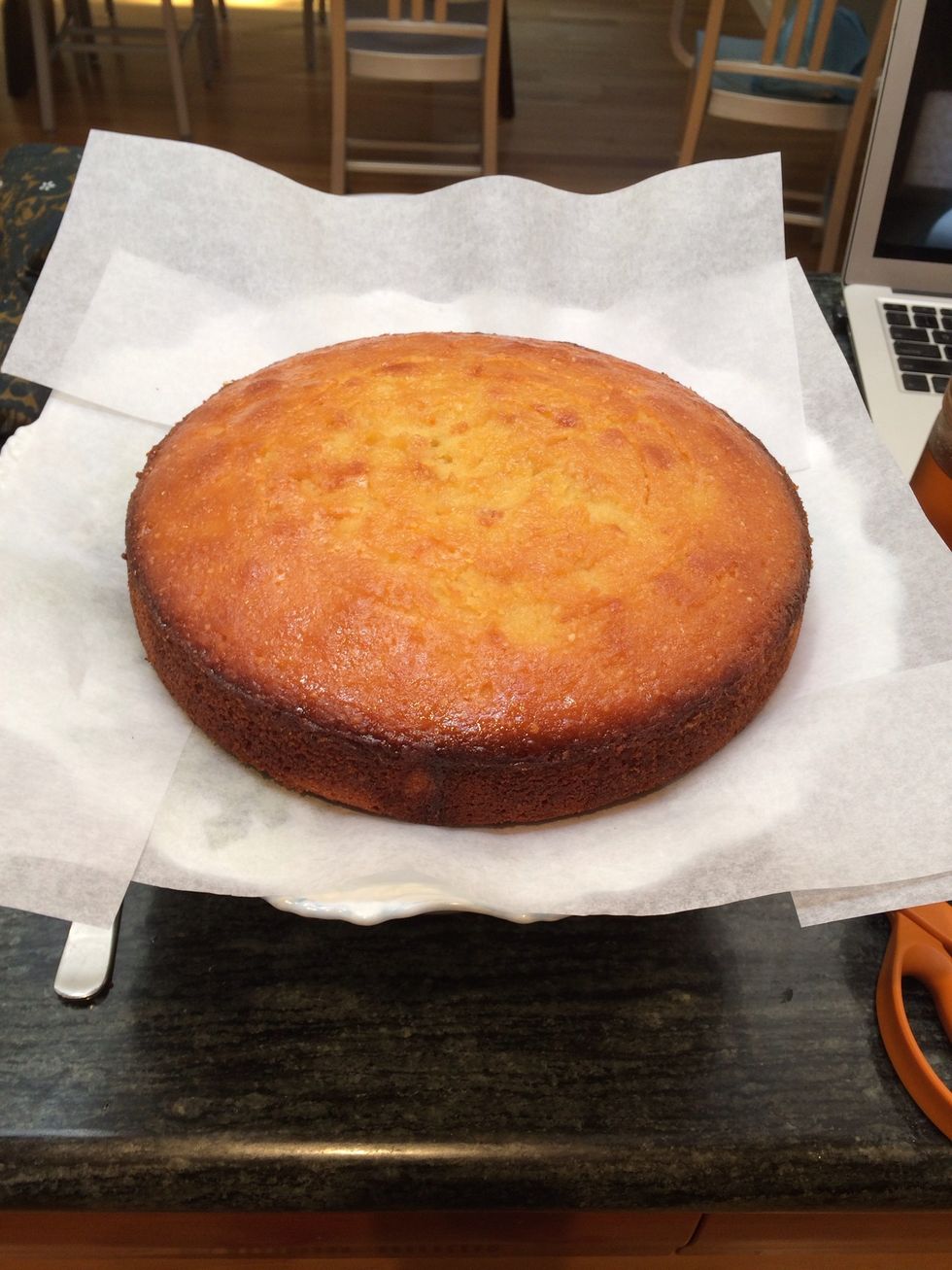 When cool, place the cake on a serving plate. I like to stick pieces of parchment paper on the bottom so that any runaway icing is easily cleaned up.
