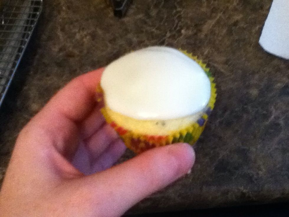 When cupcakes are totally cool, spread glaze on. It will continue to spread as it sits, so leave a little room on the edges.