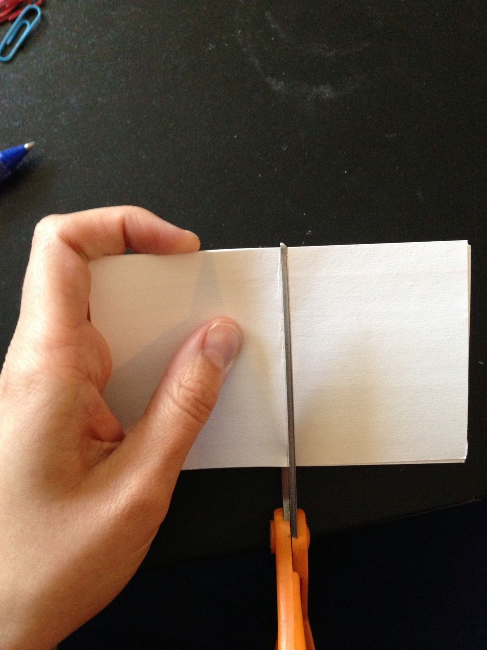 When cutting try to keep all the note cards in place by holding one side of the cards firmly.