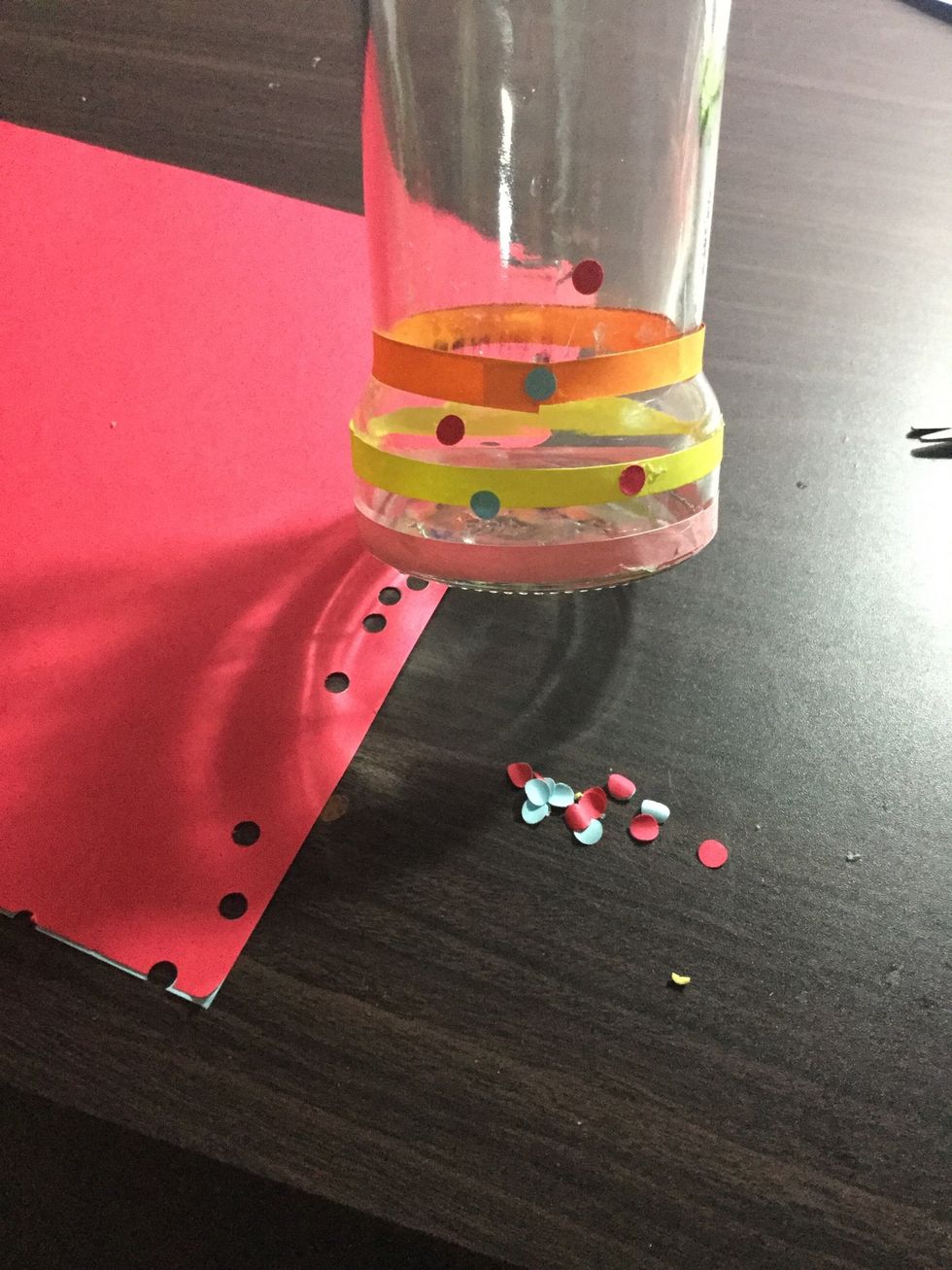 When done punch holes of colour papers with puncher and glue them in any pattern. I pasted them freely and spreaded. Colours are your own choice.