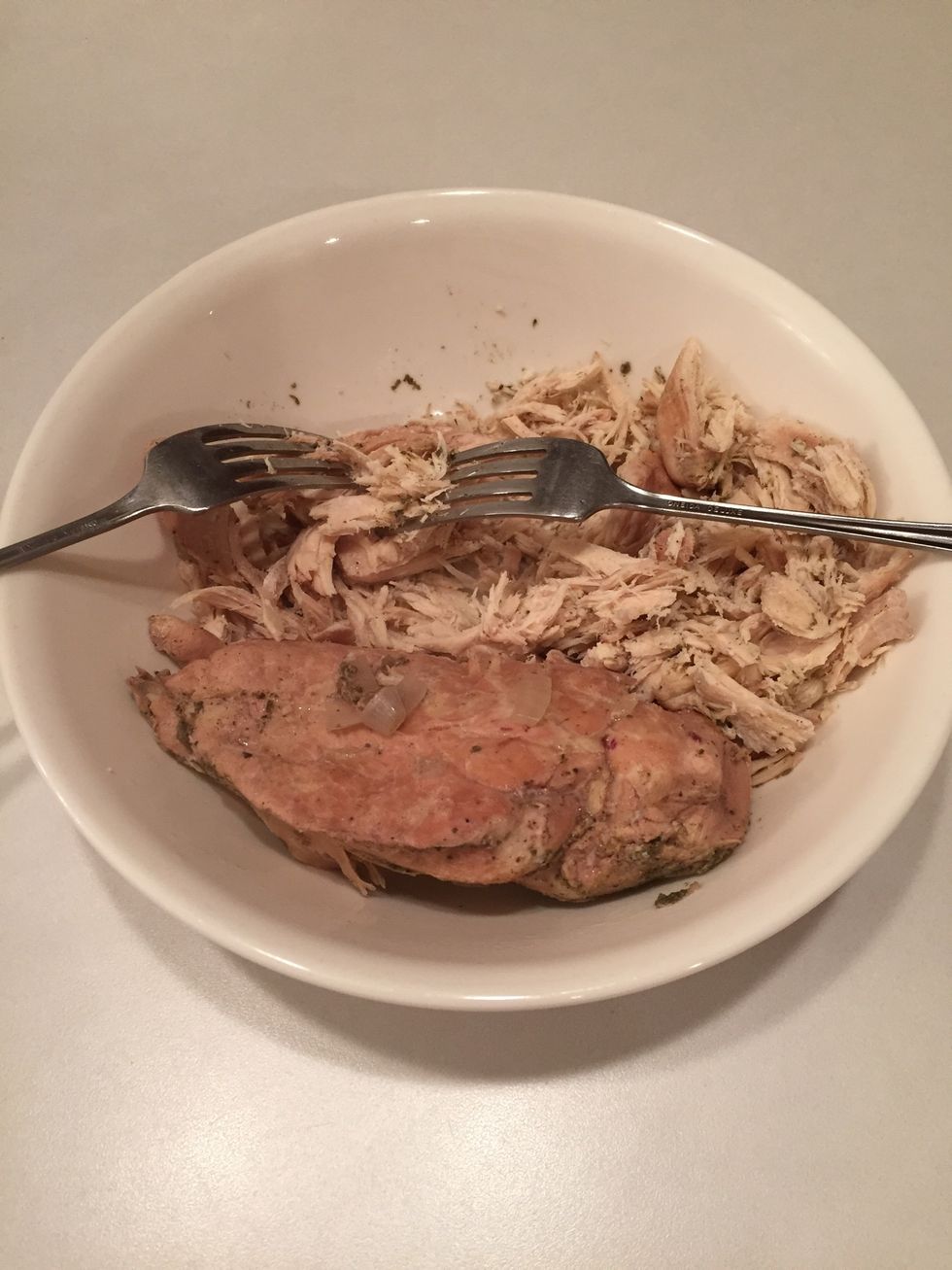 When done, remove chicken and shred with 2 forks in a bowl.