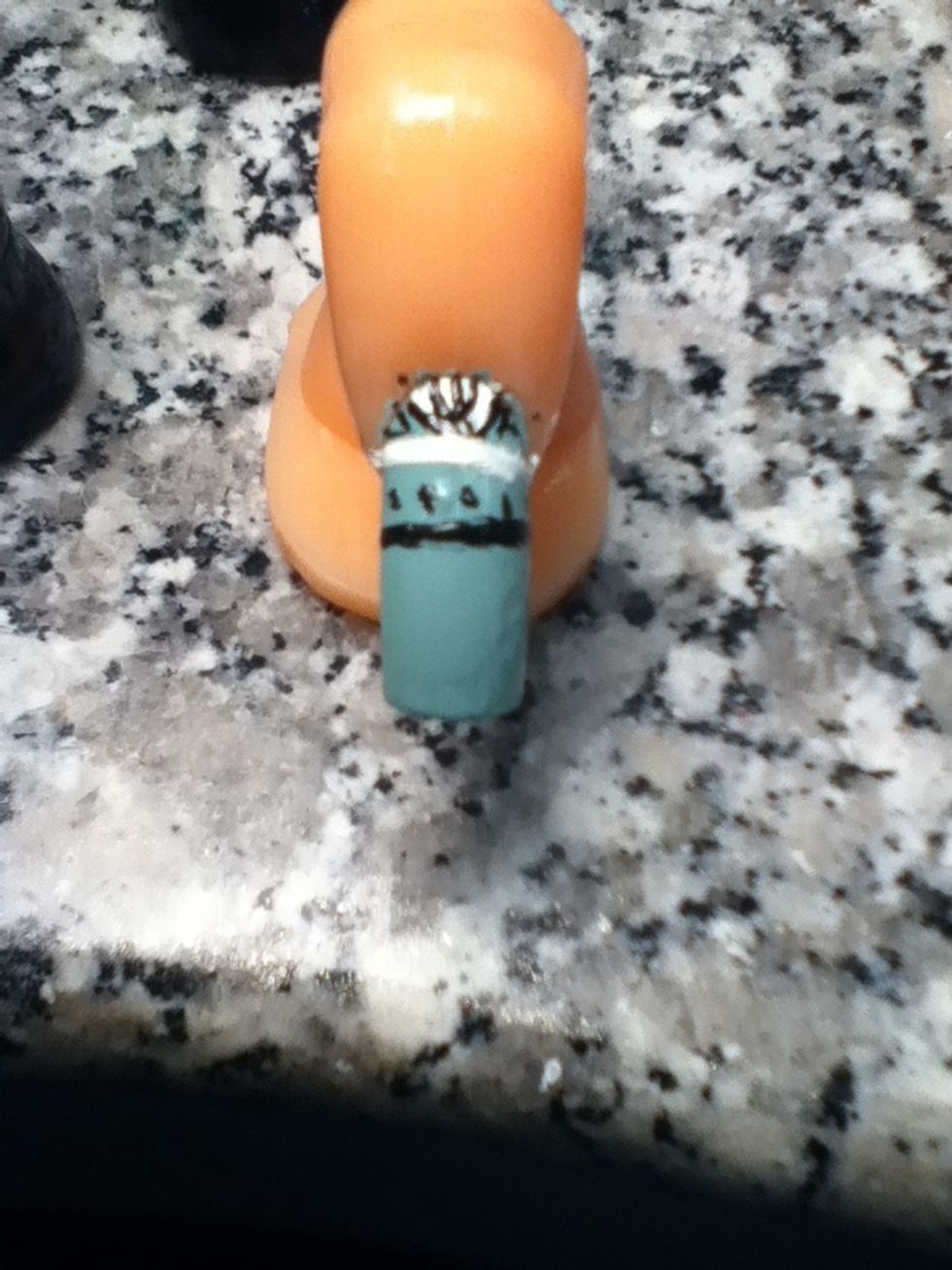 When done with that put black little dots under the white line and under the dots make a black line.