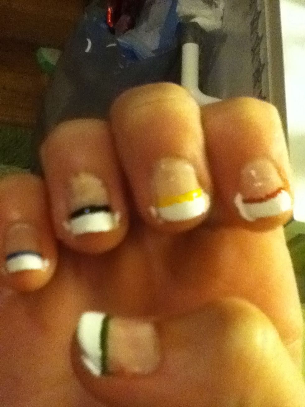 When dry, add colored stripes with the toothpick/nail pen just under the white. Leave to dry.