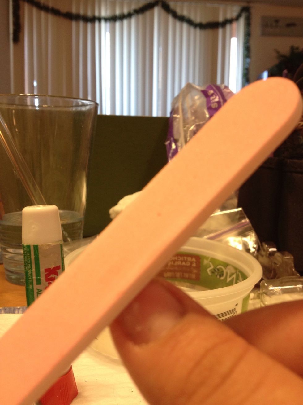 When dry begin to file down the rough area from the glue. Don't file too much as to where to take off the entire paper layer!