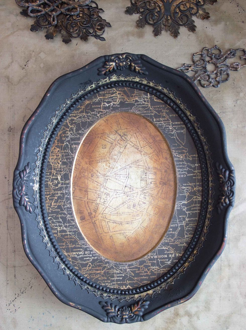 When dry, glue the Dresden in place around the center of the frame: