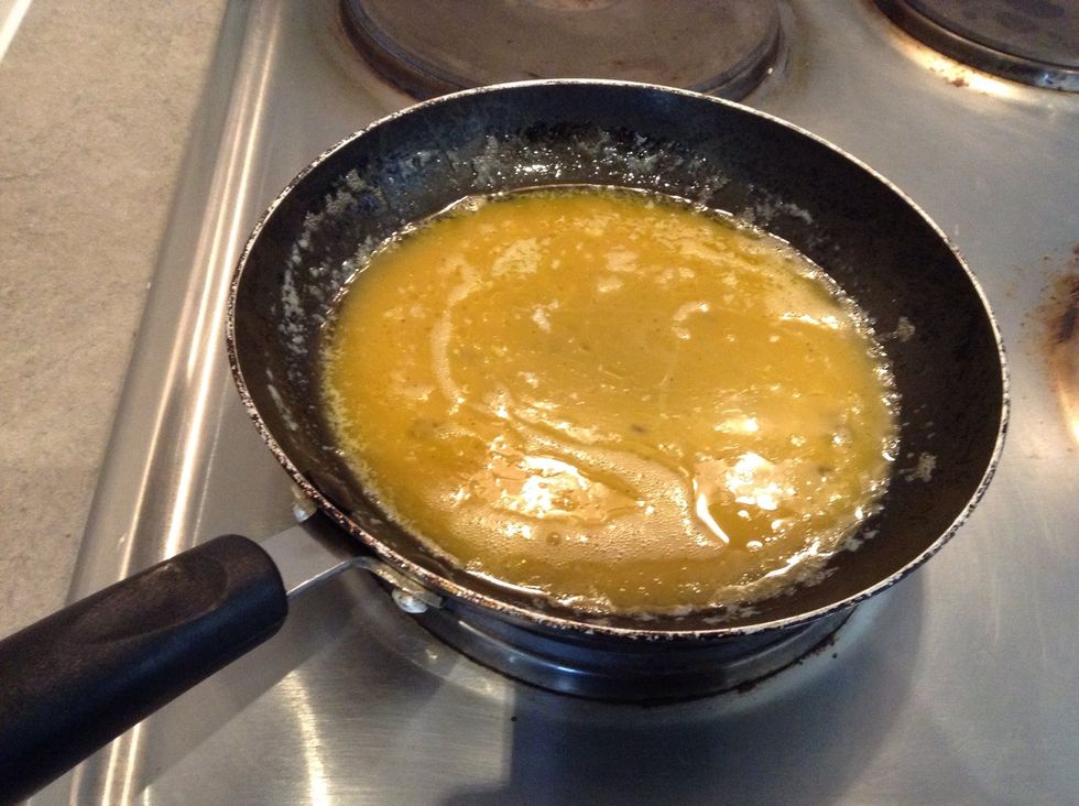 When e butter is melted and is bubbling, add your eggs and move the pan around to spread them out evenly