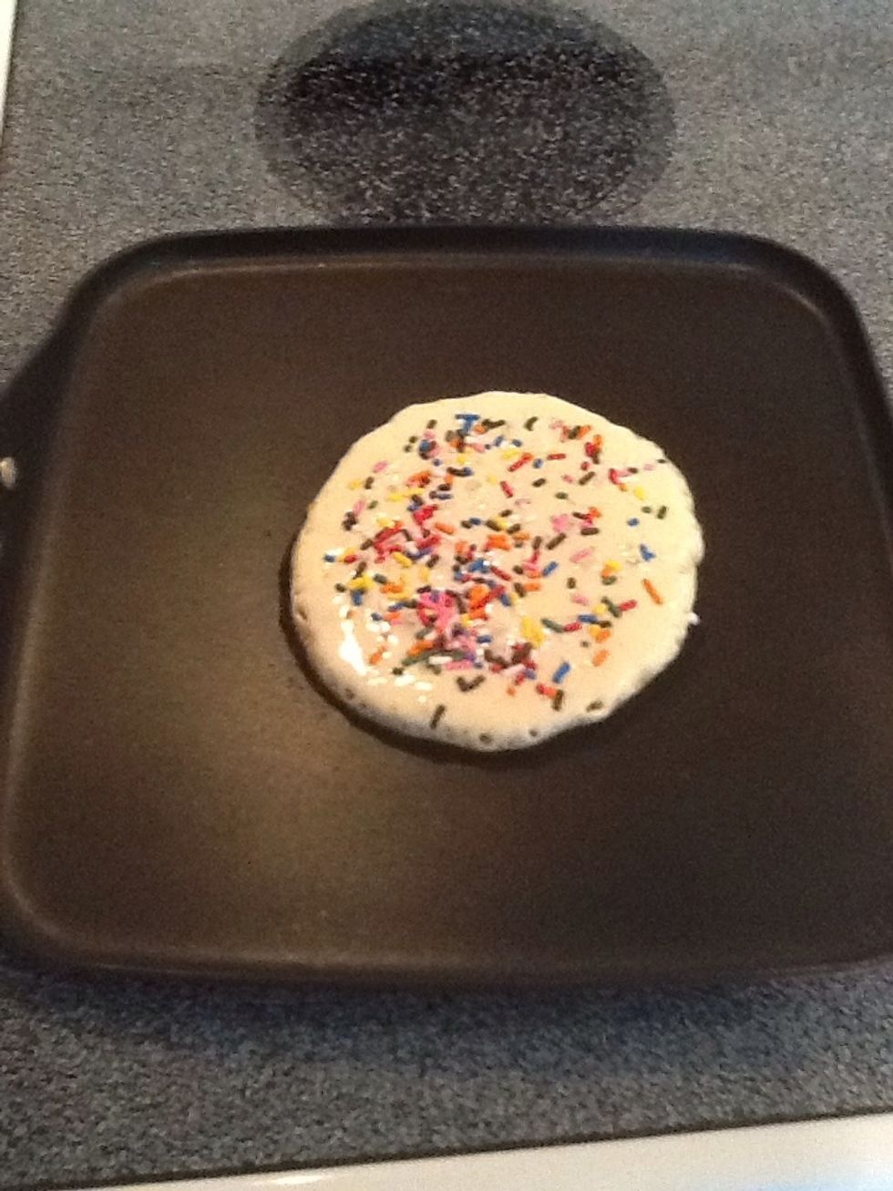 When edges start to bubble, add sprinkles and flip.
