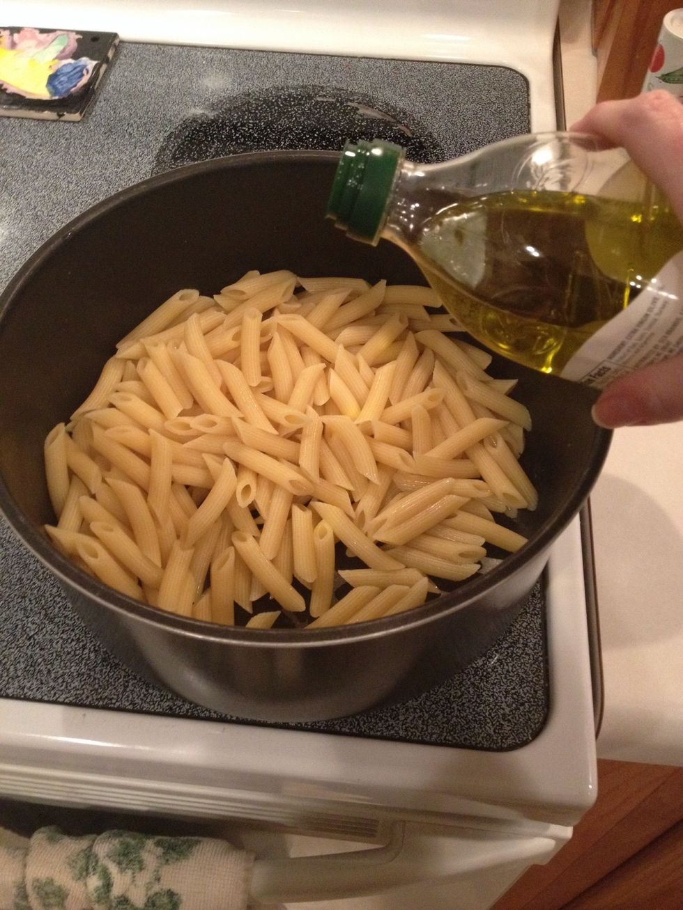 When finished cooking, drain pasta and add 1 Tbsp. oil to keep pasta from sticking. Set aside.
