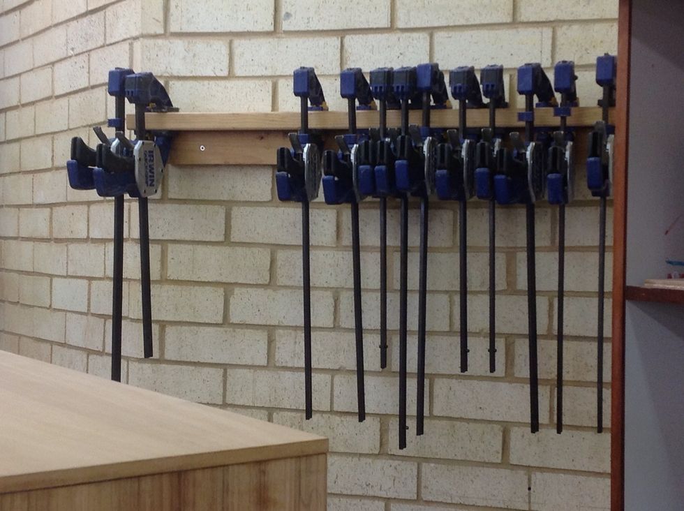 When finished gluing put some clamps on the board to help the glue stick.