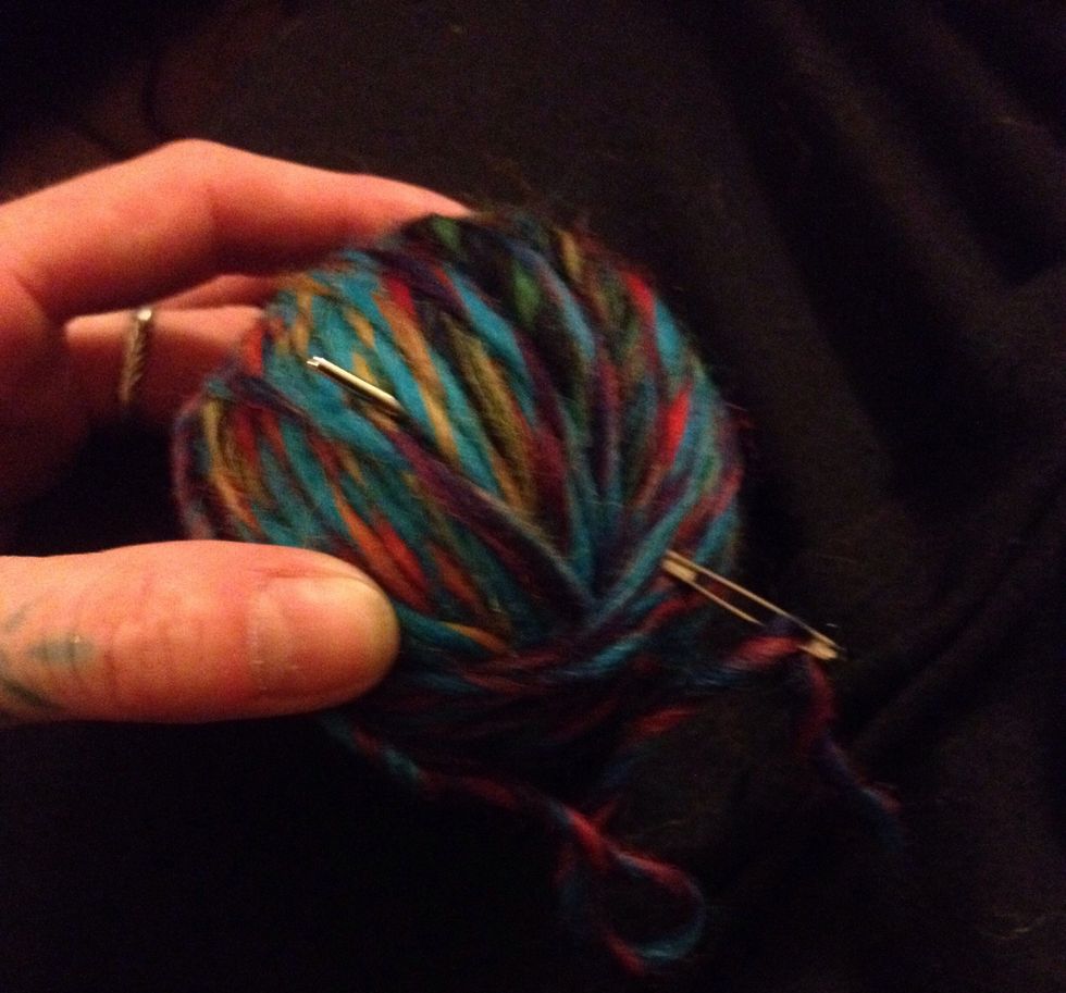 When finished, pull end of wool through a few layers of the ball with your needle or hook. Do this a few times