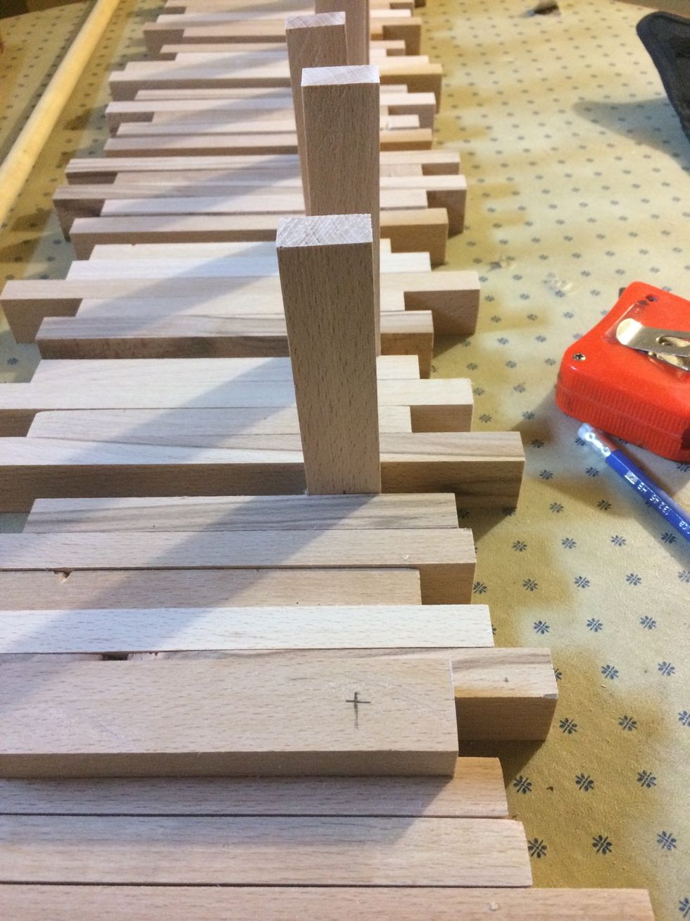 When finished the sanding I marked the hooks where the dowel was going through them. It was about 1.25" from the bottom.