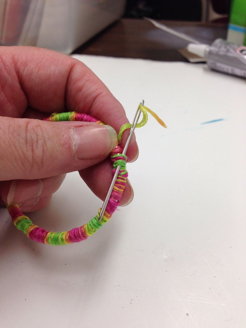 When finished wrapping, run the needle backward through several of the wraps to secure.