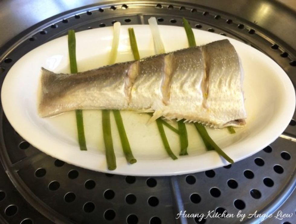 When fish is cooked, remove fish from steamer.