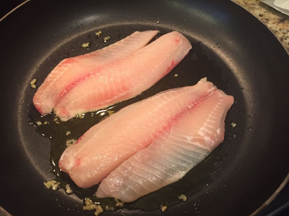 When garlic is fragrant, put in your fish.