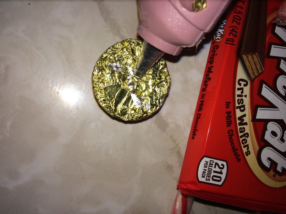 When glue drys hot glue the bottom of your candies to the top of the kit Kat bar