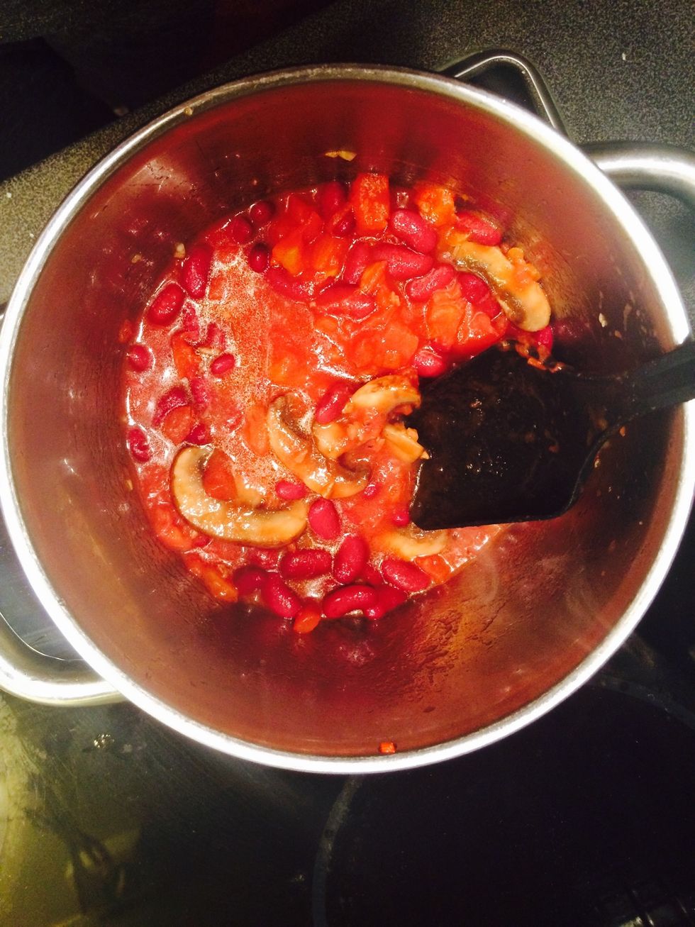 When golden brown add tomatoes and beans