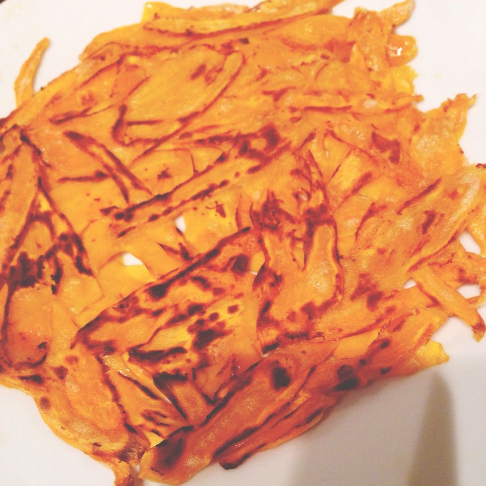 When golden put a plate against the pan and flip potato rosti onto the plate. Put the rosti back on the pan with the spatula and heat on the other side for 10-12 mins or until golden like this.