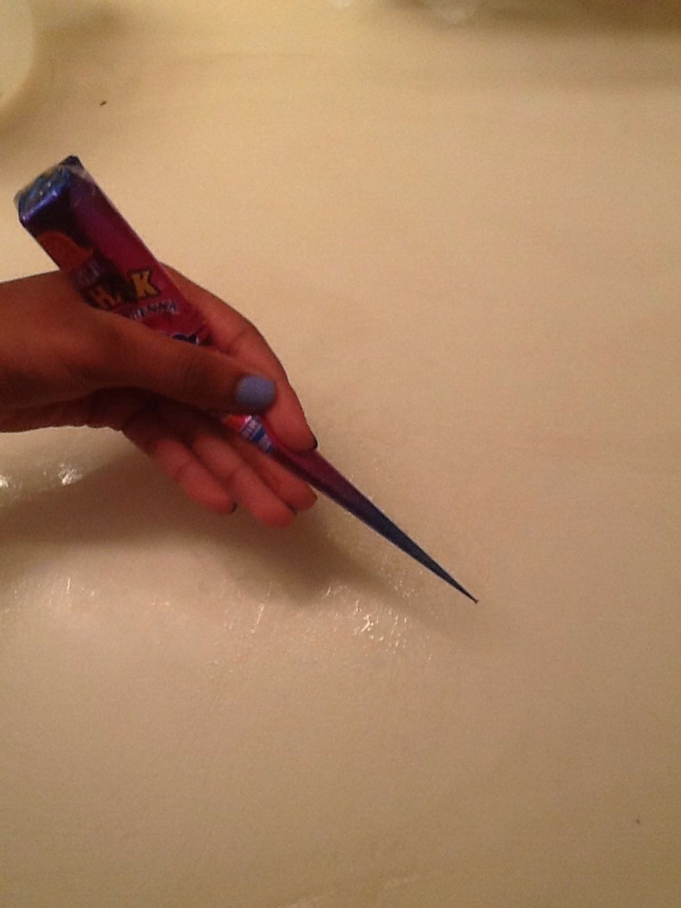 When holding the tube, hold it in the middle and hold it like you would hold a pencil.