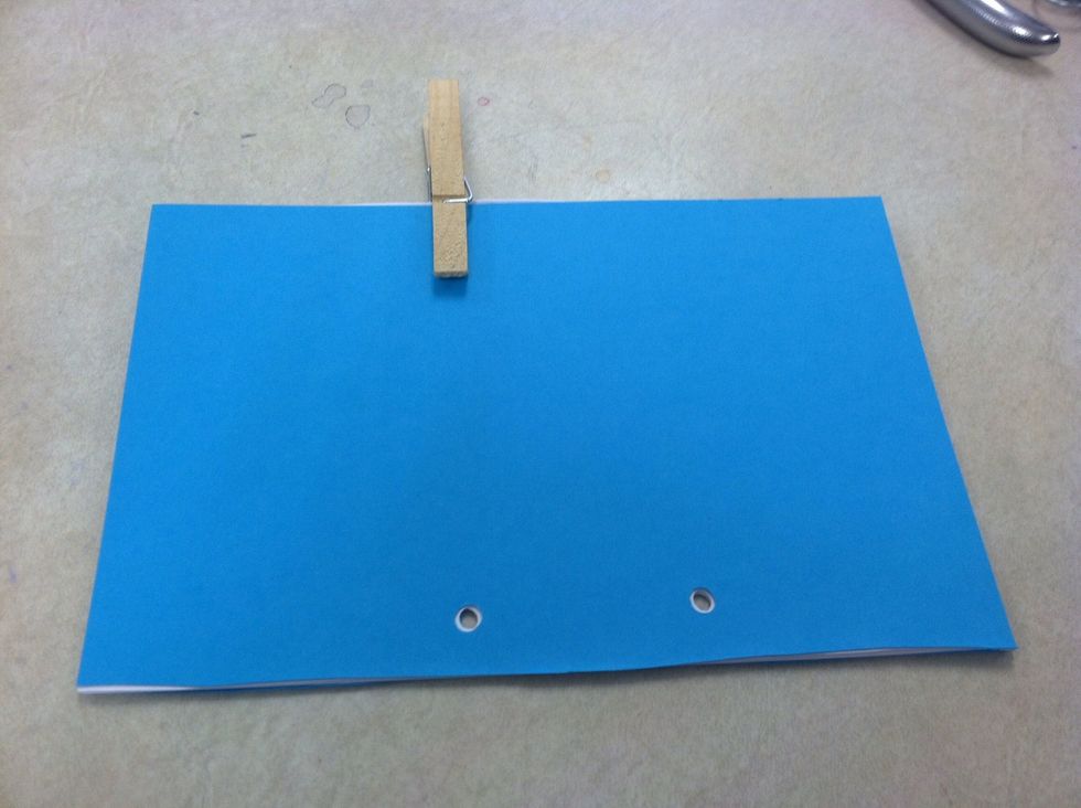 When holes line up, clip all the pages together.