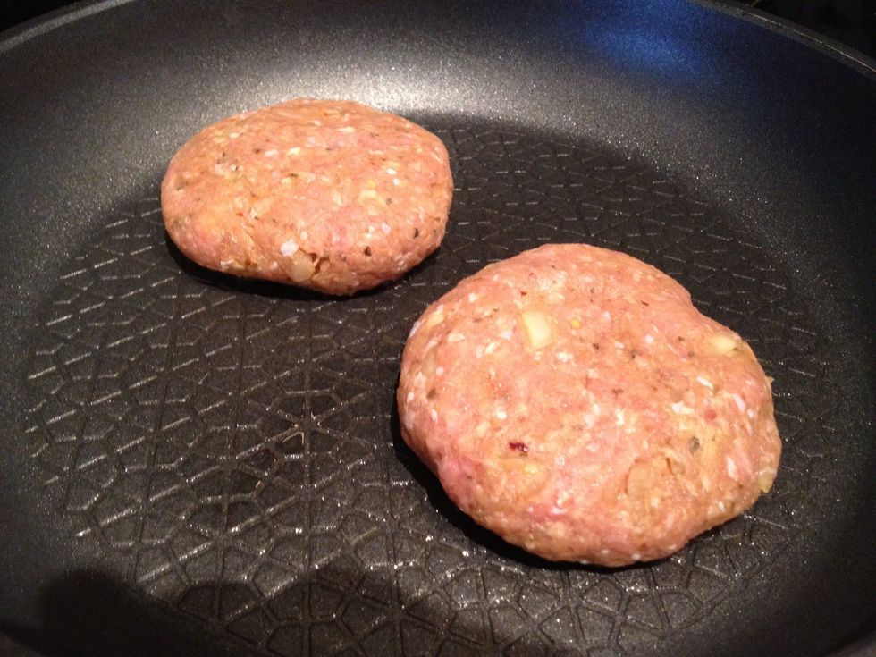 When hot, add patties, cook for 4 minutes, adding some good olive oil halfway through for basting, then flip