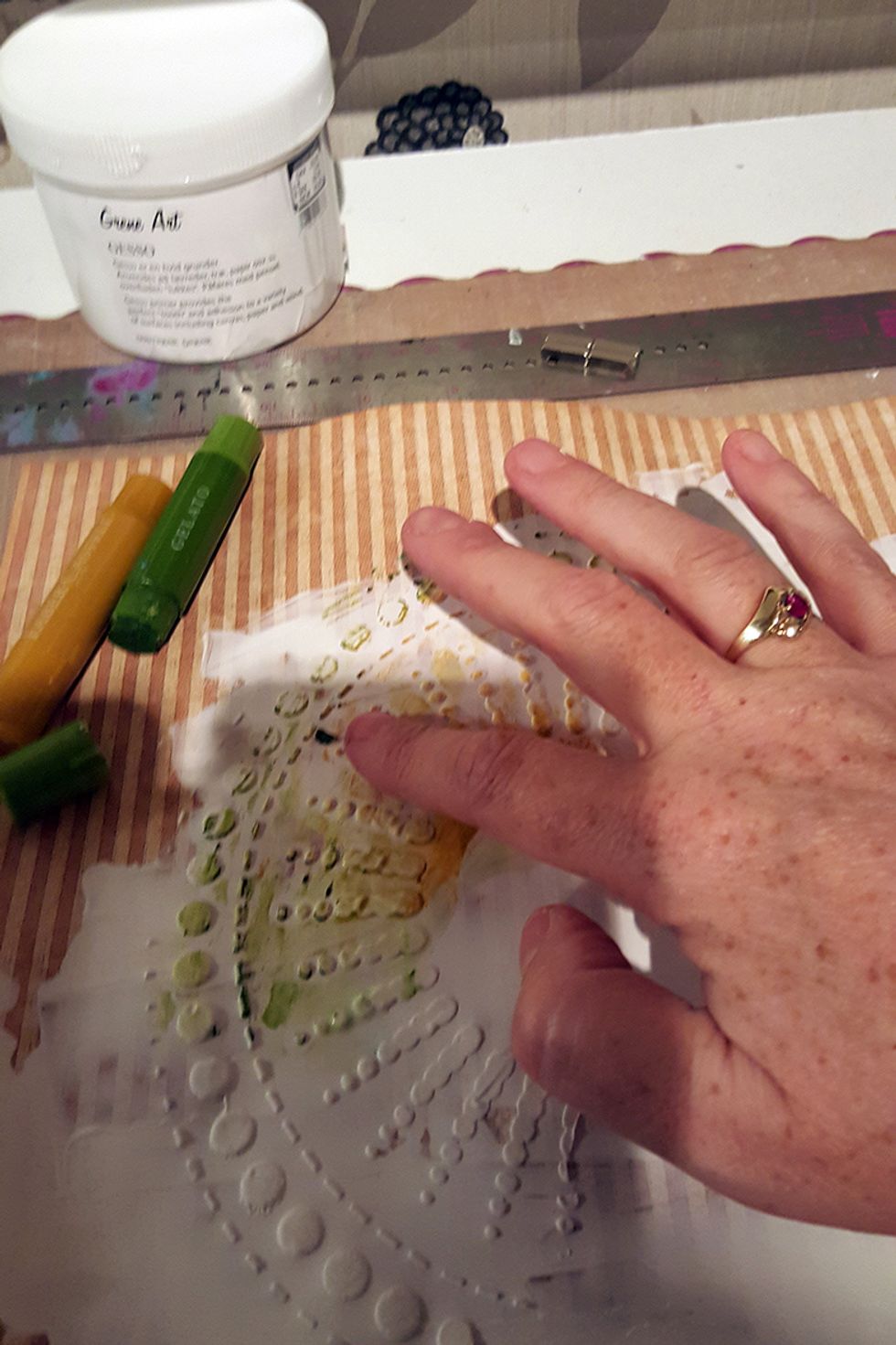 When I have added the gelatos, I use water on my fingers and drag the paint over the pattern.