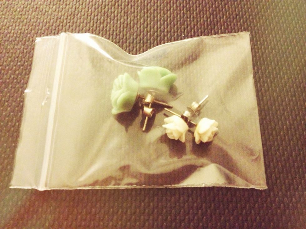 When I travel, I put my studs in a little zip lock bag and drop them in my make up pouch. Easy peasy :)