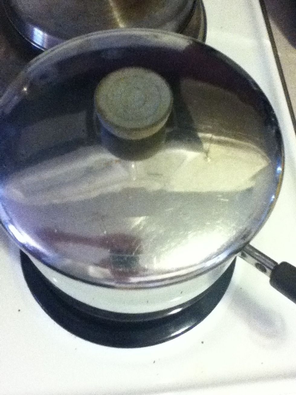 When it boils, add the mussels, then take it off the heat and cover it right away. By the time you're finished setting the table, those mussels will be done!