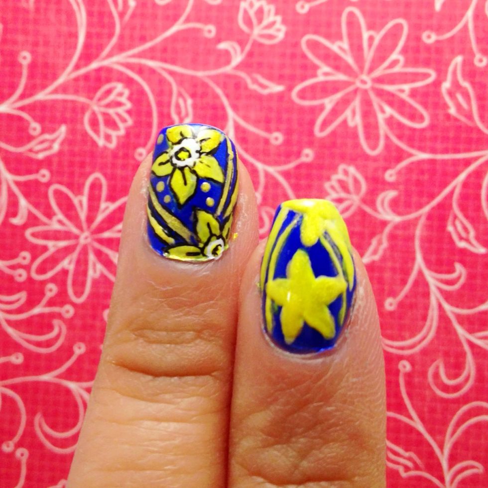 When it dries. Layer the design with a bright yellow polish and shimmery yellow polish. This allows the color to pop