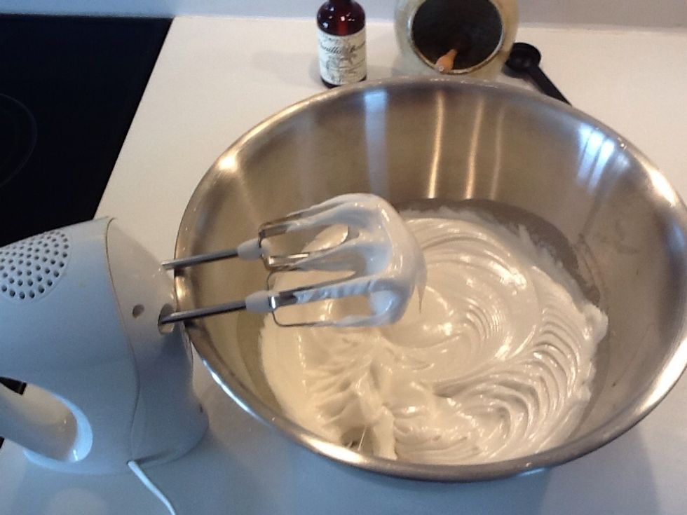 When it has become thick and hold peaks like a meringue, take the bowl off the saucepan and whisk in the vanilla. Keep whisking while the mixture cools a little.