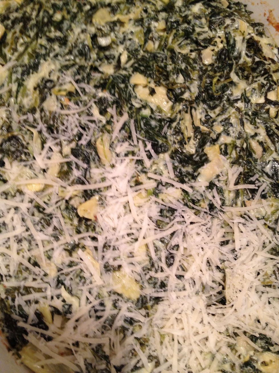 When it is just about finished, take it out of the oven and spread 1/4 cup Parmesan cheese and 1/4 cup mozzarella cheese on top and put under broiler for 1 minute to melt cheese.