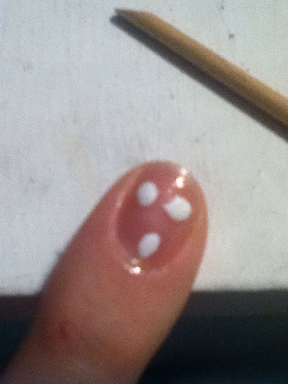 When it is still squishy to the touch but not wet, press down each dot with your finger