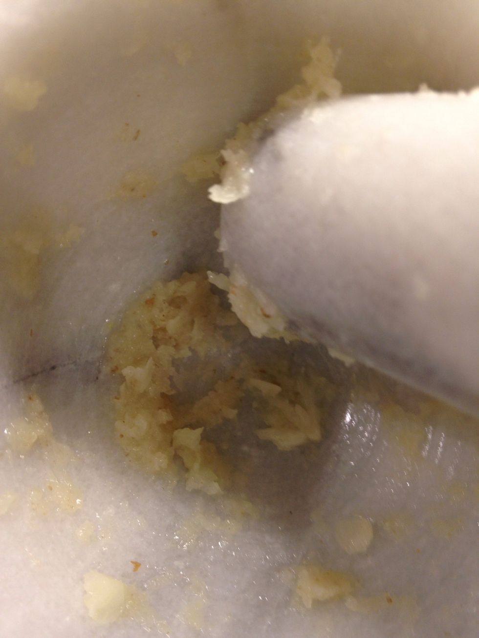 When it look like a paste squeeze a little lemon juice in there. Very slowly add the olive oil. While stirring