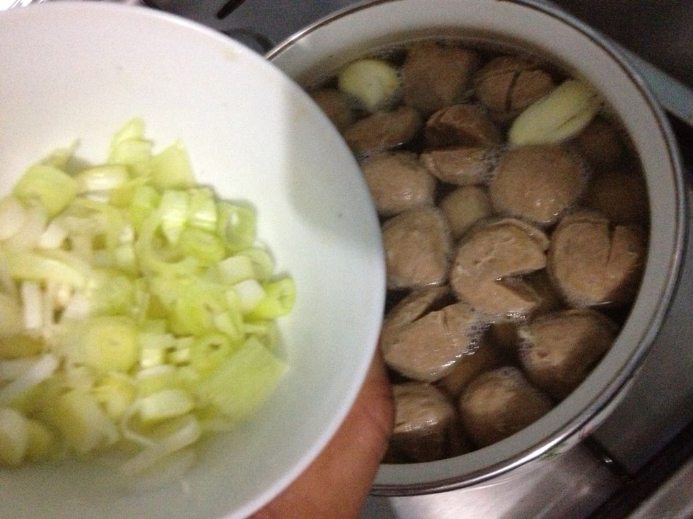 When it's almost time to serve, add in the sliced scallions into the simmered stock. Turn off the heat. Put in a separate bowl. Set aside