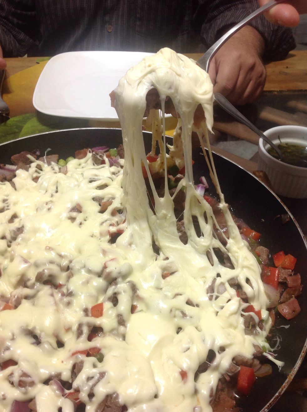 When it's cooked, top it whit the cheese, and let it melt.