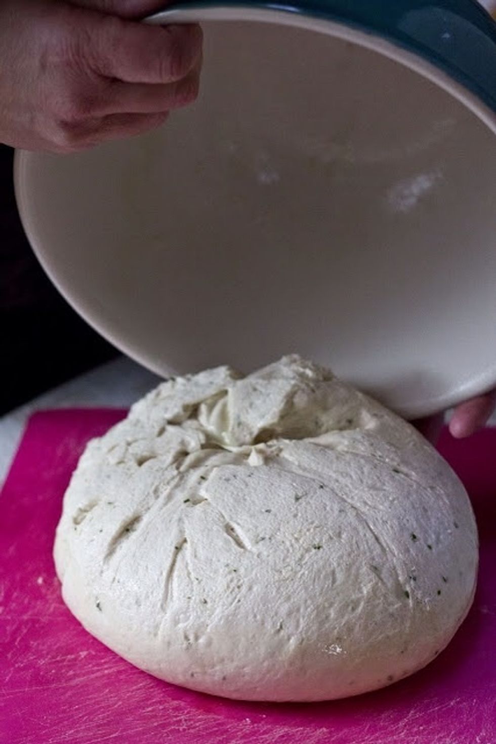When it's doubled, dump it out on to a clean surface, (you don't have to flour it.)