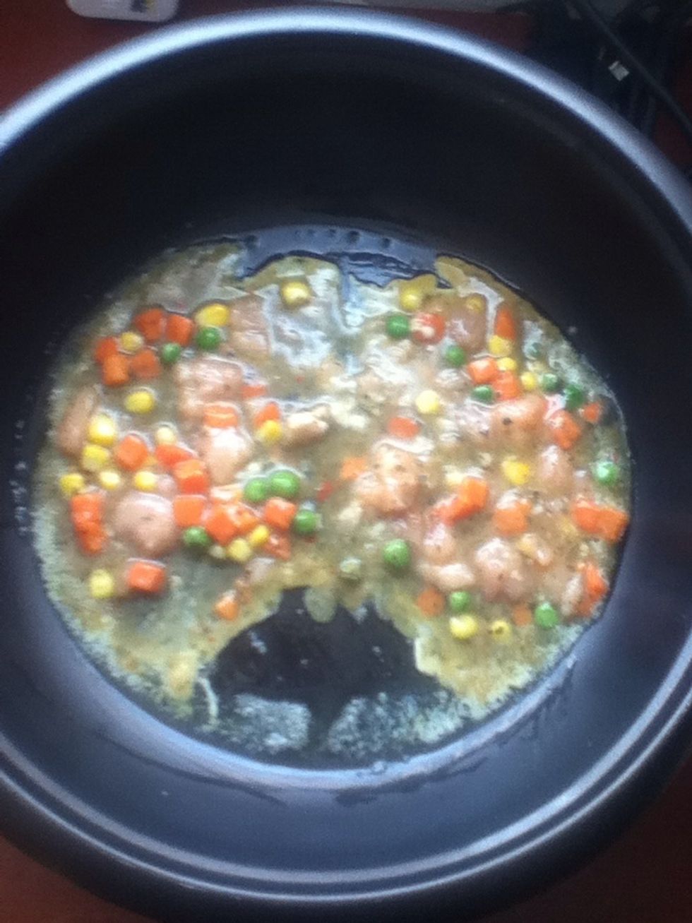 When it's hot enough, pour a little of your egg mixture. I'm dividing them into two part here.