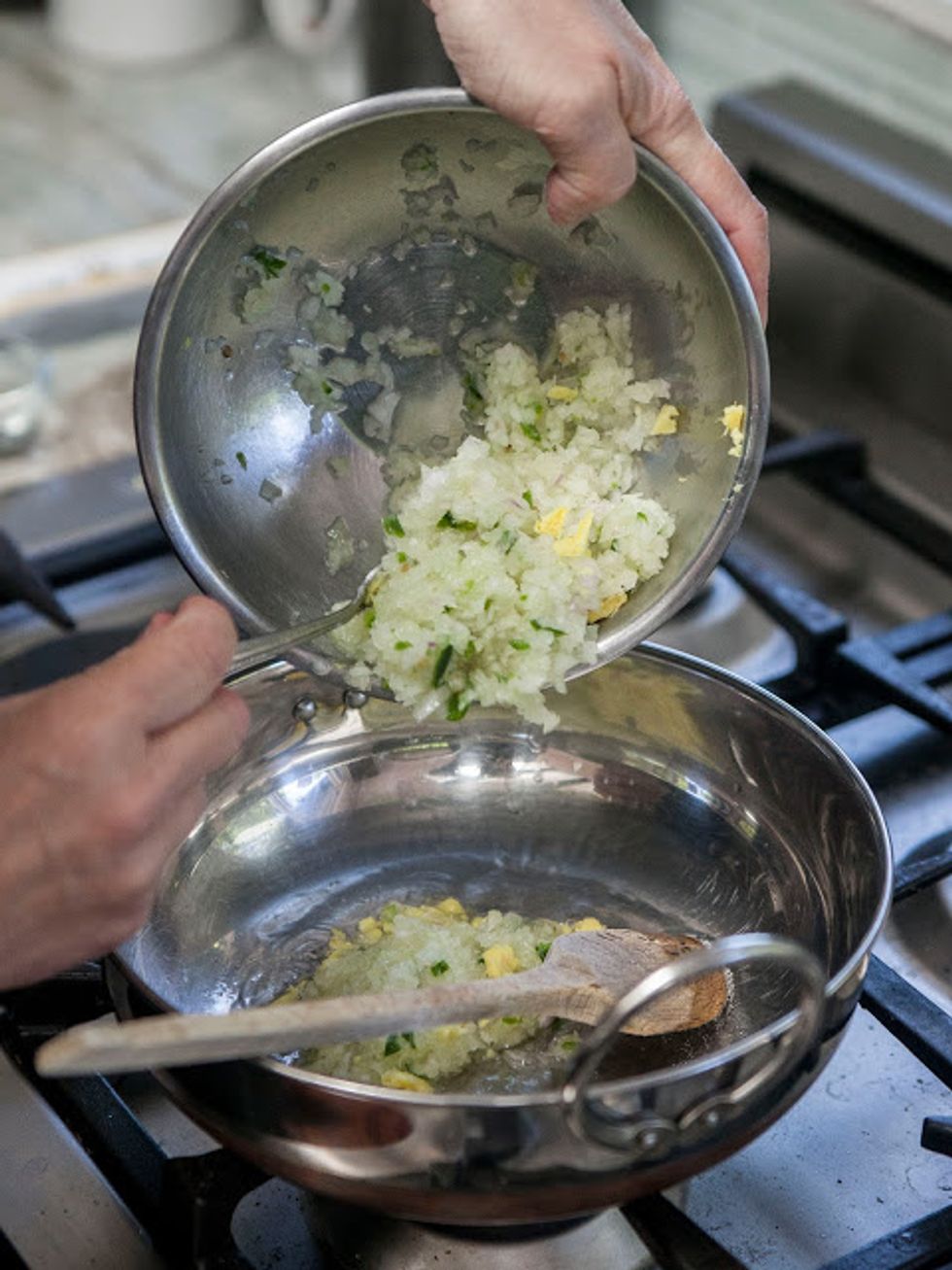 When it's hot, toss in the chicken (if you are not using precooked chicken) onion, ginger, shallot, and serrano chili.