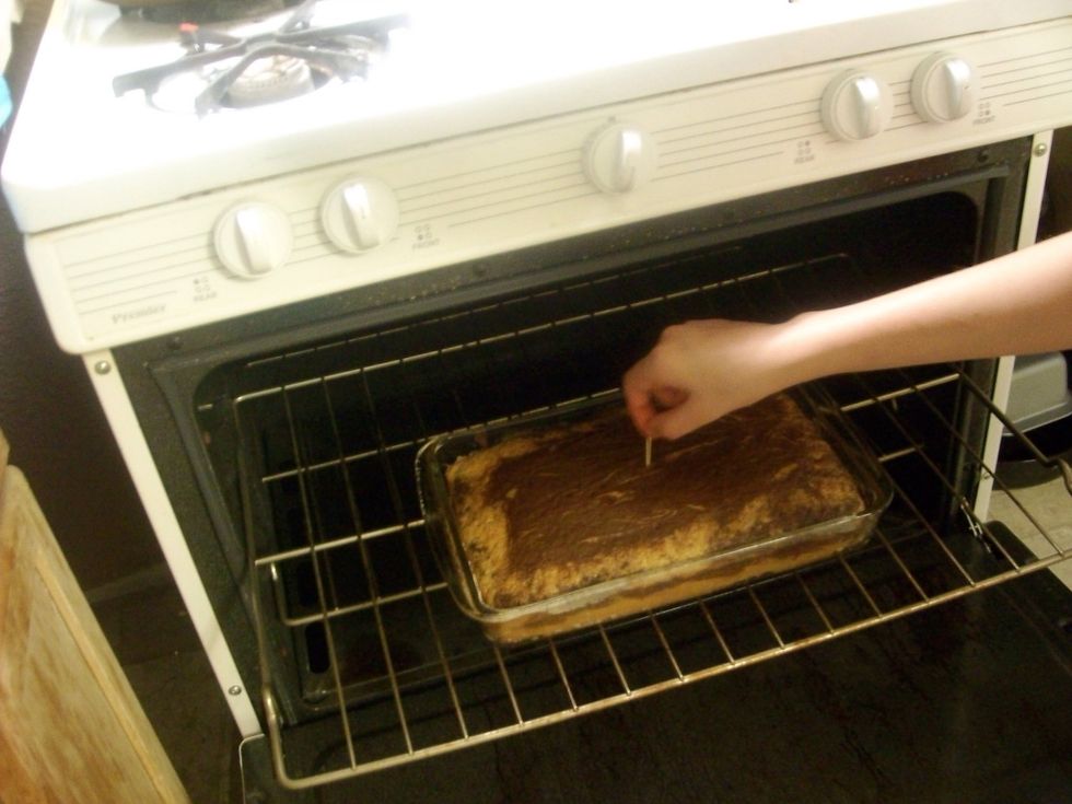 When it's time to take it out check it with a toothpick. If nothing appears on the toothpick then it's done.