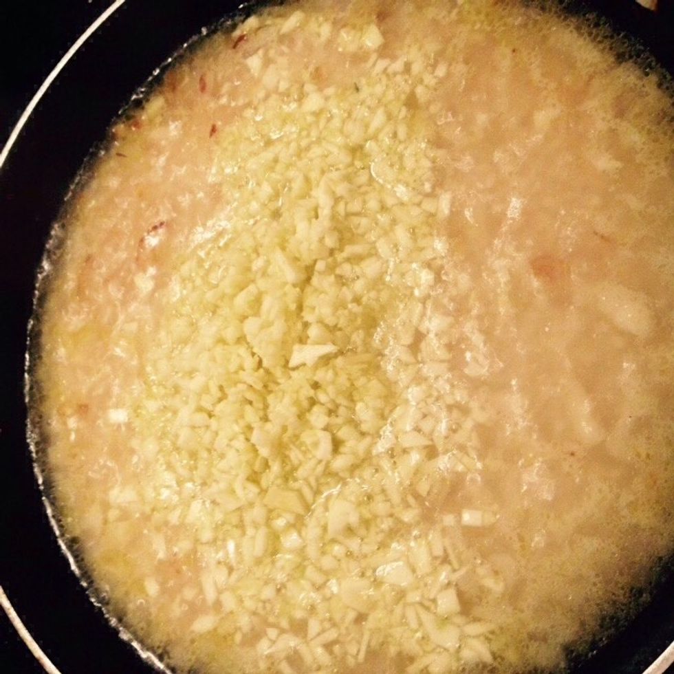 When it starts boiling again add the chopped white parts of courgettes