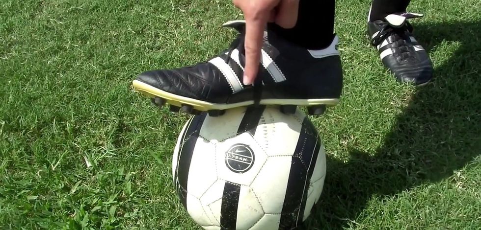 When kicking the ball (you're not kicking it yet!) kick it with your instep