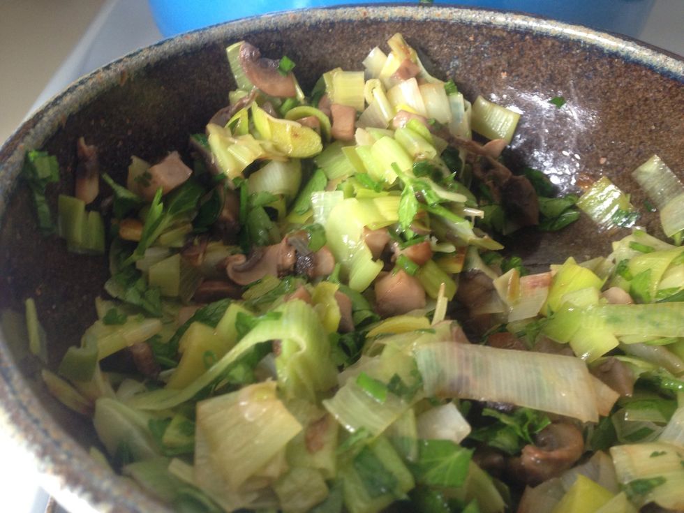 When leeks are done, add them to the mushrooms with the chopped herbs. Wait for them to cool a bit before adding to the eggs (or else they'll cook the egg in weird bits).