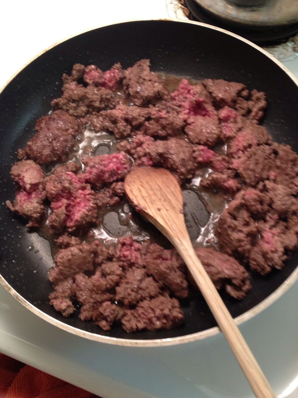 When meat is finish add to pan. Cook till no longer pink and drain all the liquid out. By now you tomatoes should be boiling do not let it burn!