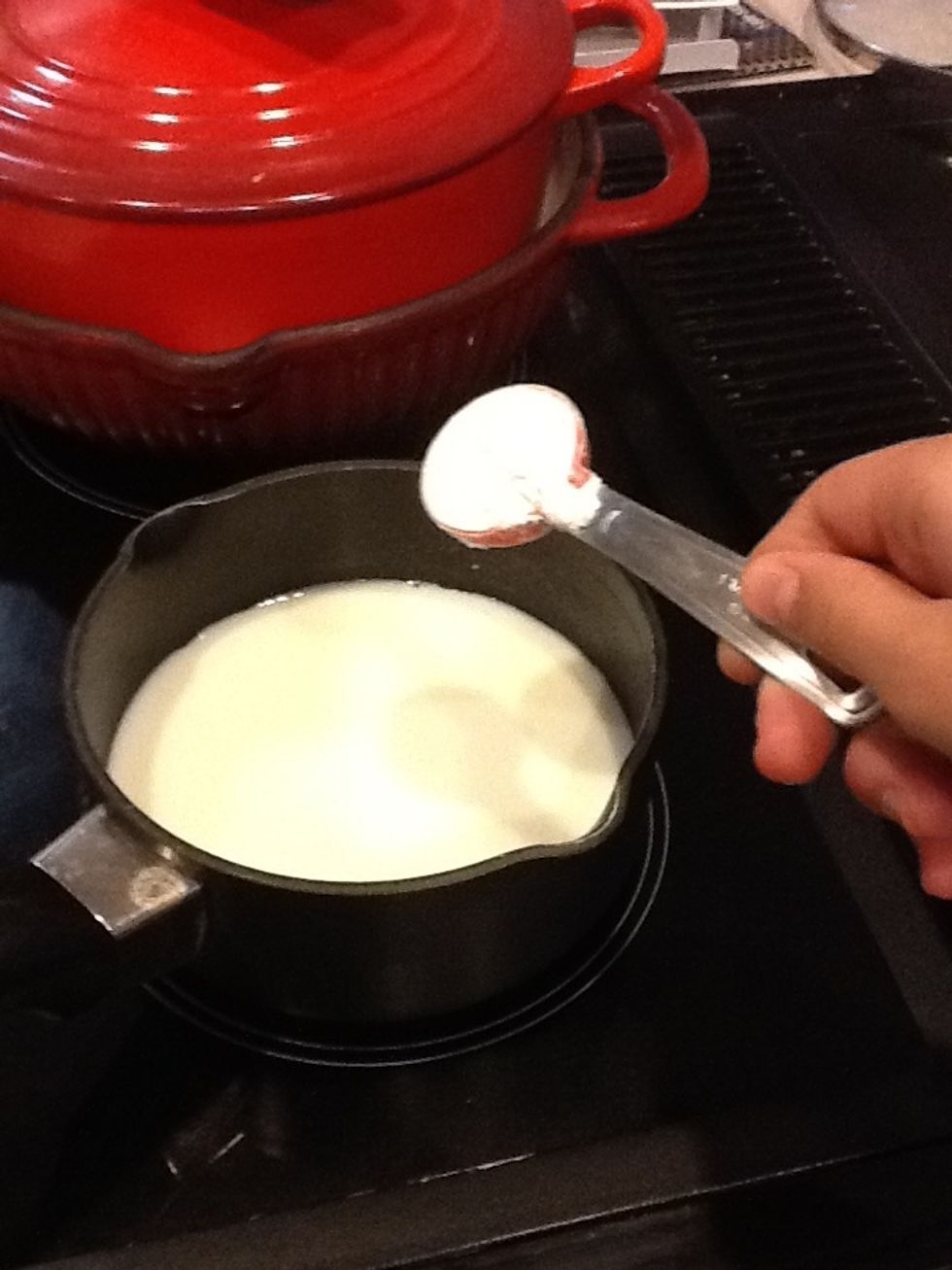When milk is warm, pour in flour and whisk until thickened. (If milk does not thicken, add more flour accordingly)